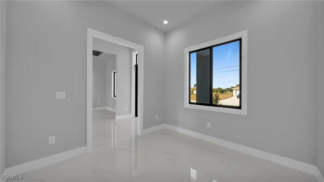 a kitchen with granite countertop a sink and cabinets