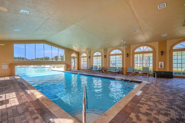 a large hall with lots of swimming pool and outdoor seating