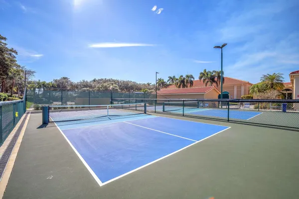 a view of an outdoor space and tennis court