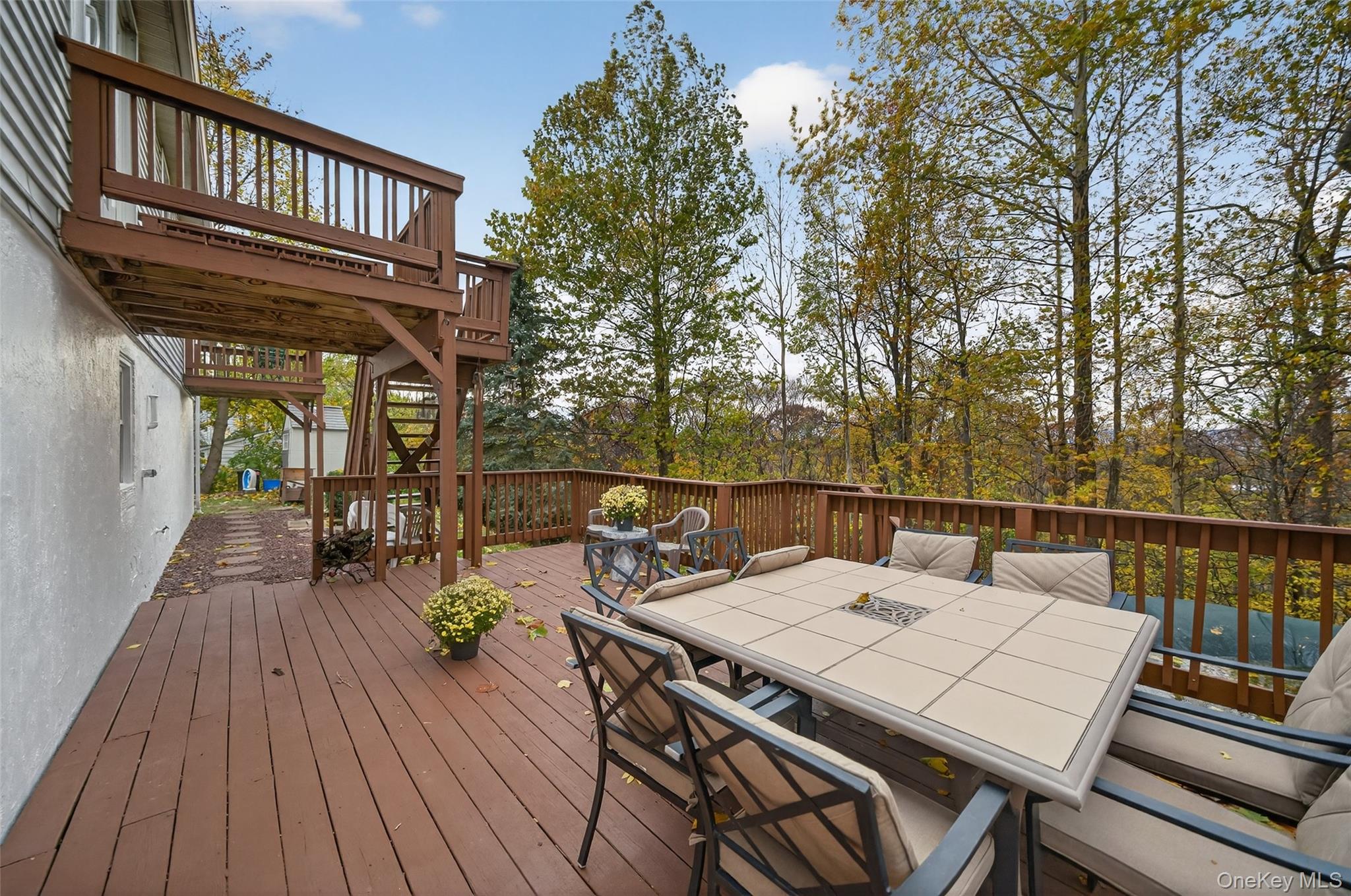 7 Colleen Lane Wallkill, NY 12589 - Photo 14 of 39 Wooden terrace featuring stairs and outdoor dining area
