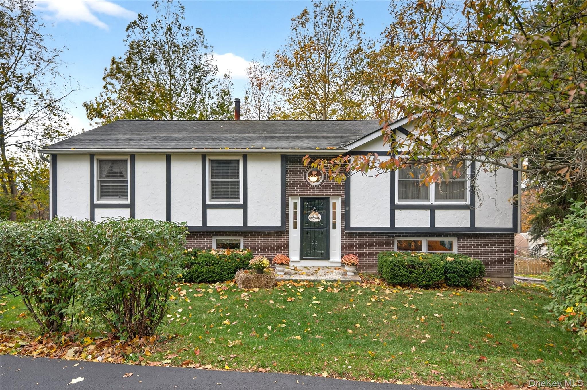 7 Colleen Lane Wallkill, NY 12589 - Photo 2 of 39 Raised ranch with brick siding, a front lawn, and stucco siding