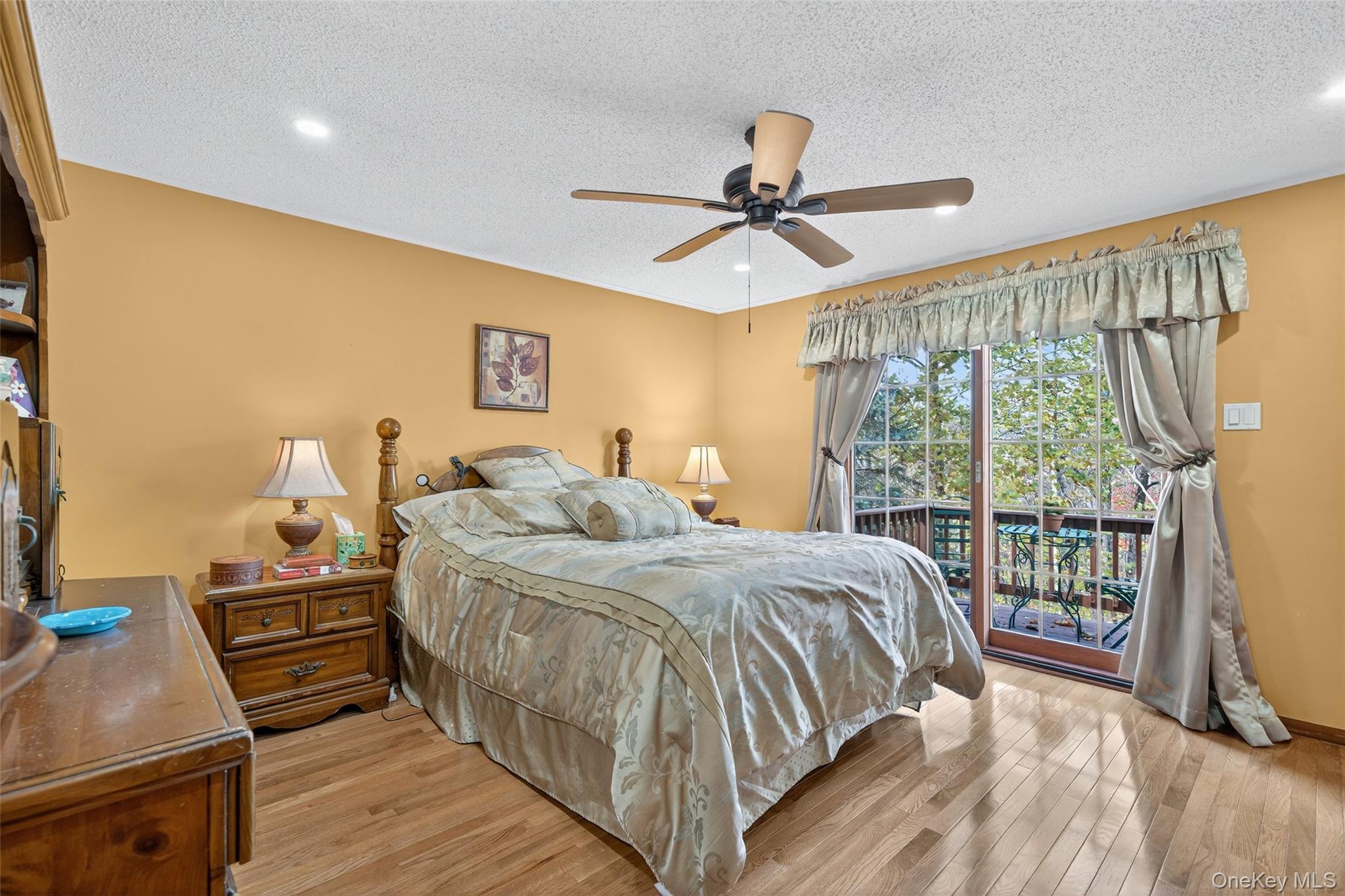 7 Colleen Lane Wallkill, NY 12589 - Photo 21 of 39 Bedroom with access to outside, light wood finished floors, a textured ceiling, and ceiling fan