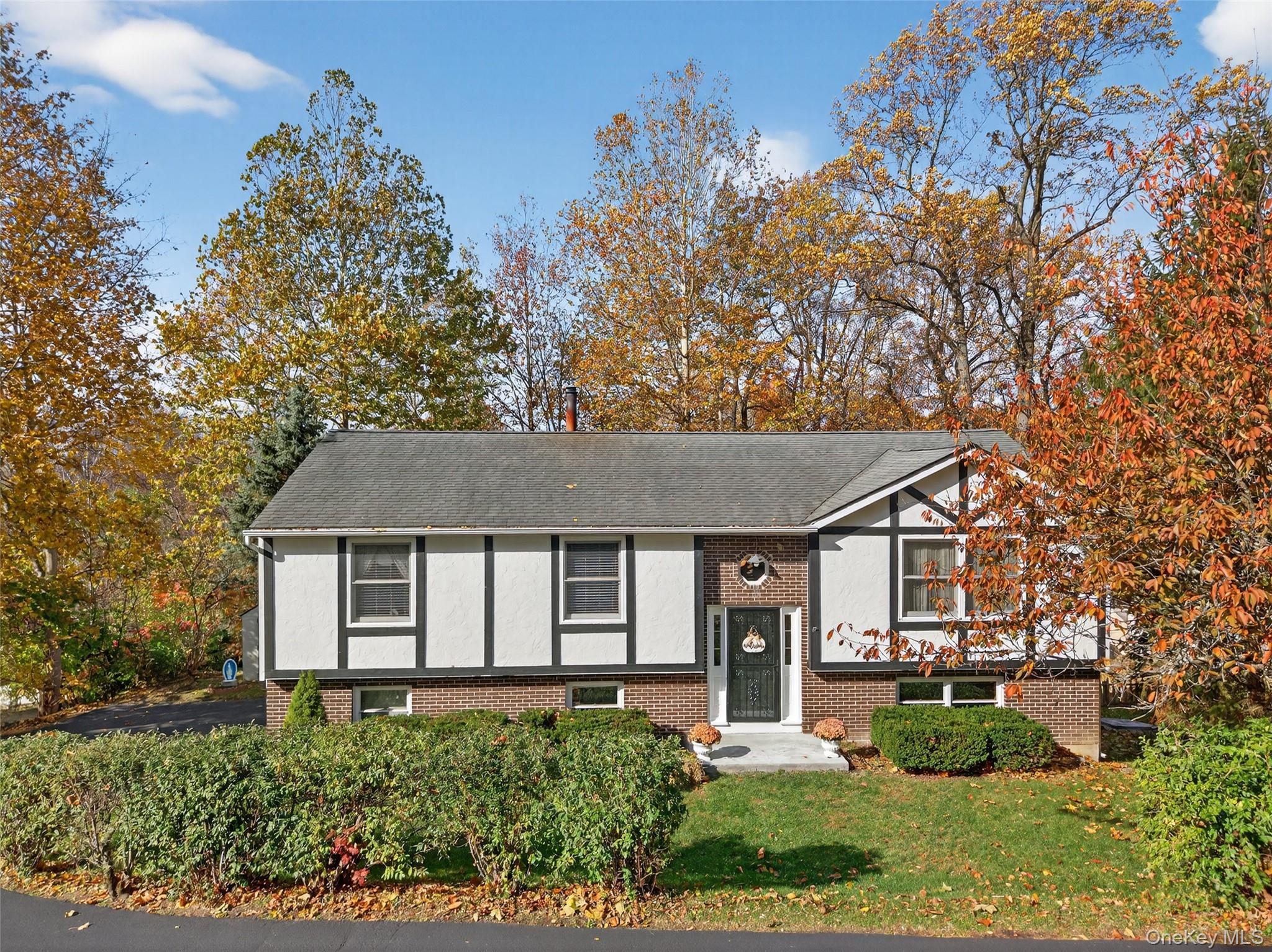 7 Colleen Lane Wallkill, NY 12589 - Photo 36 of 39 Split foyer home featuring brick siding, a front yard, and stucco siding