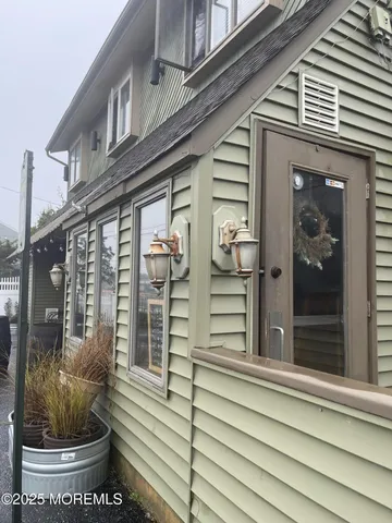 a view of balcony with wooden floor and fence
