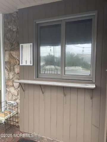 a kitchen with white cabinets white stainless steel appliances and sink