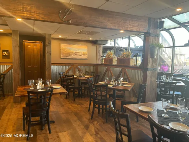a view of a dining room with furniture and window