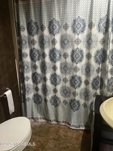 a stove top oven sitting inside of a kitchen