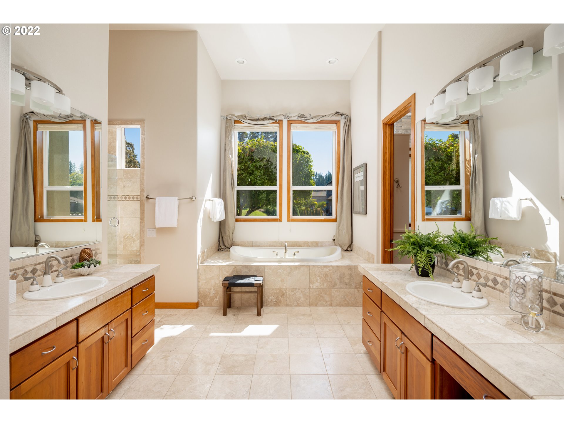 6228 Northwest El Rey Drive Camas, WA 98607 - Photo 15 of 32 a bathroom with a sink double vanity mirror and a bathtub