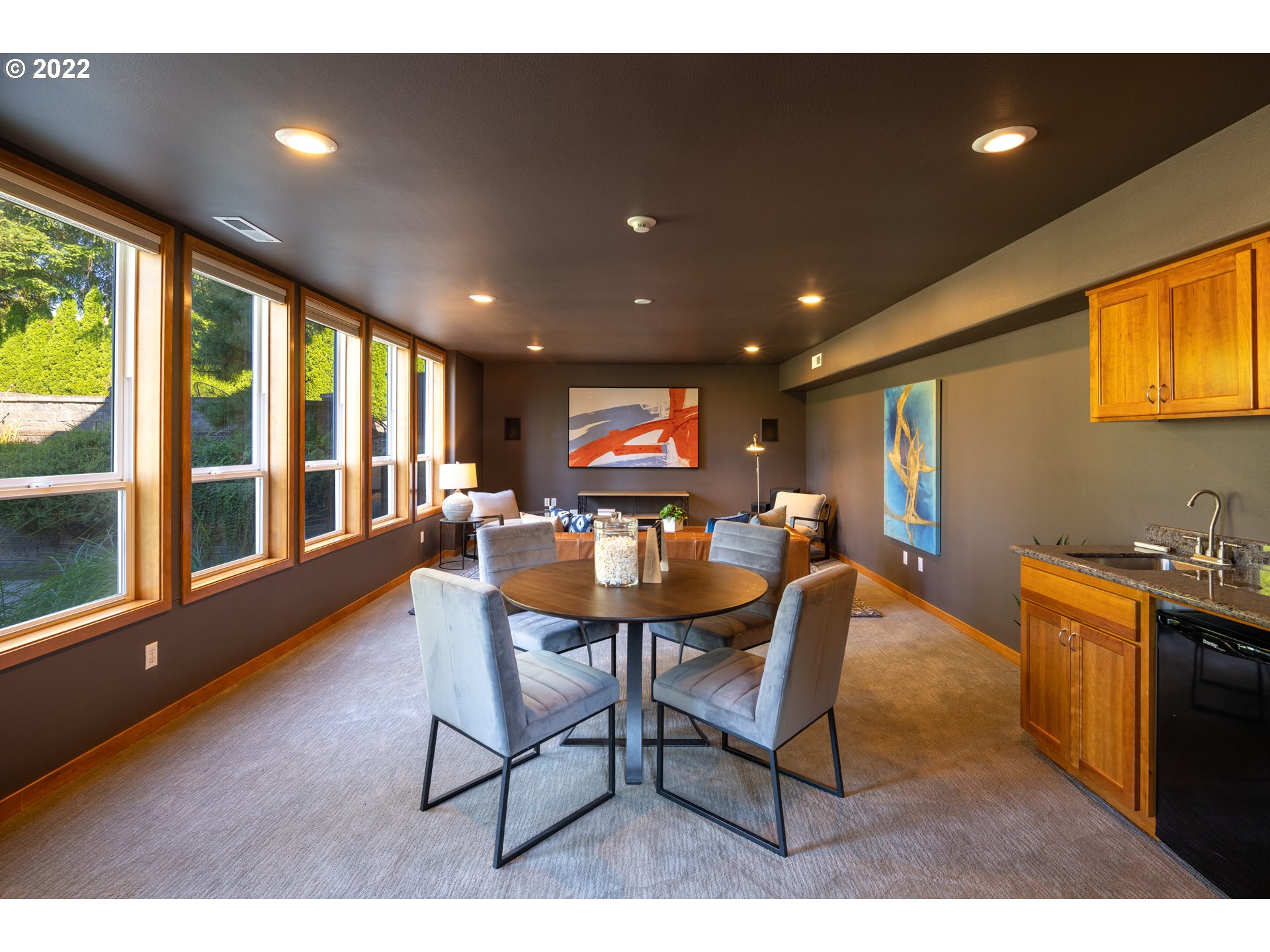 6228 Northwest El Rey Drive Camas, WA 98607 - Photo 23 of 32 a living room with furniture and a floor to ceiling window