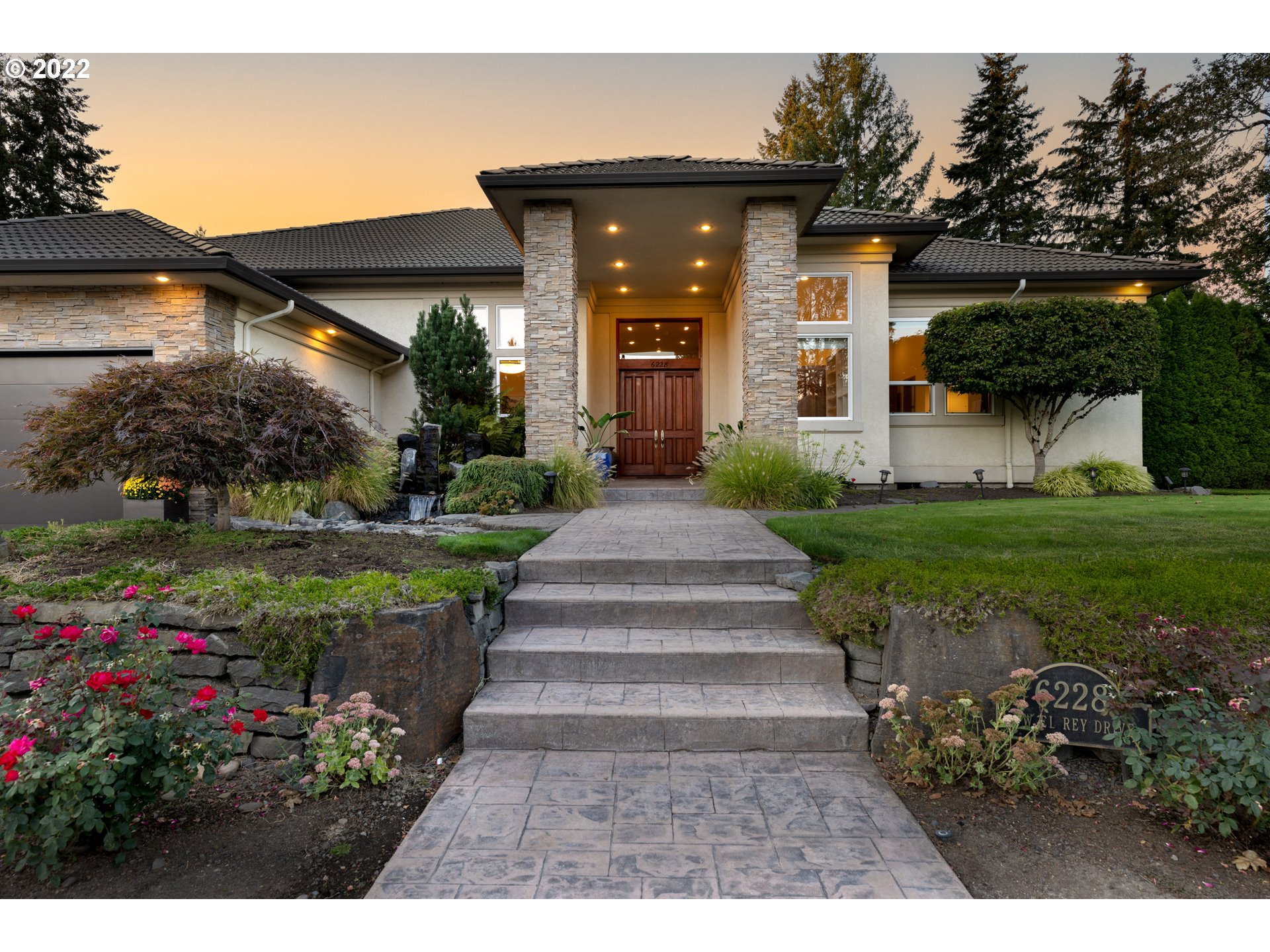 6228 Northwest El Rey Drive Camas, WA 98607 - Photo 3 of 32 a front view of a house with a yard and potted plants