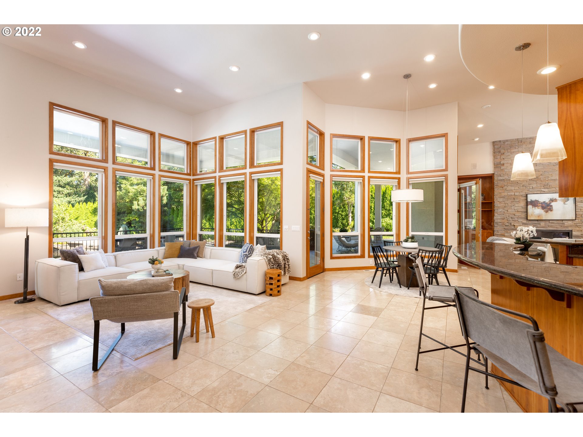 6228 Northwest El Rey Drive Camas, WA 98607 - Photo 9 of 32 a living room with furniture and floor to ceiling windows