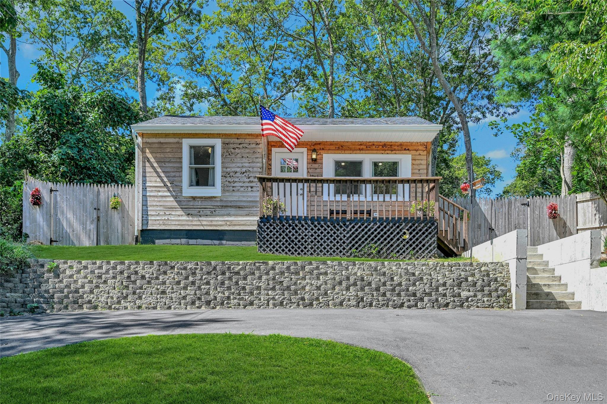 2 Setauket Trail Ridge, NY 11961 - Photo 1 of 1 View of front of home featuring a wooden deck and stairs