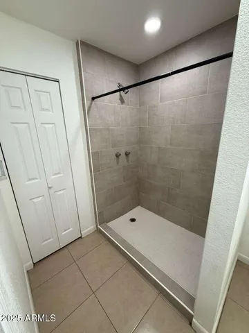 a bathroom with a shower and a toilet