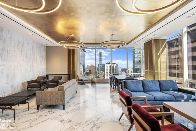 a bathroom with a sink mirror and toilet