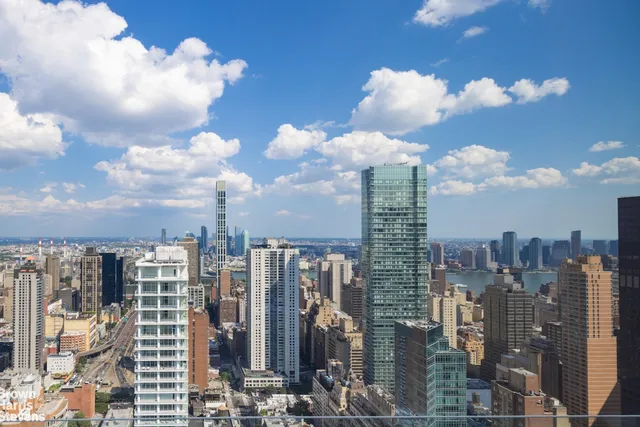 a living room with a table and chairs
