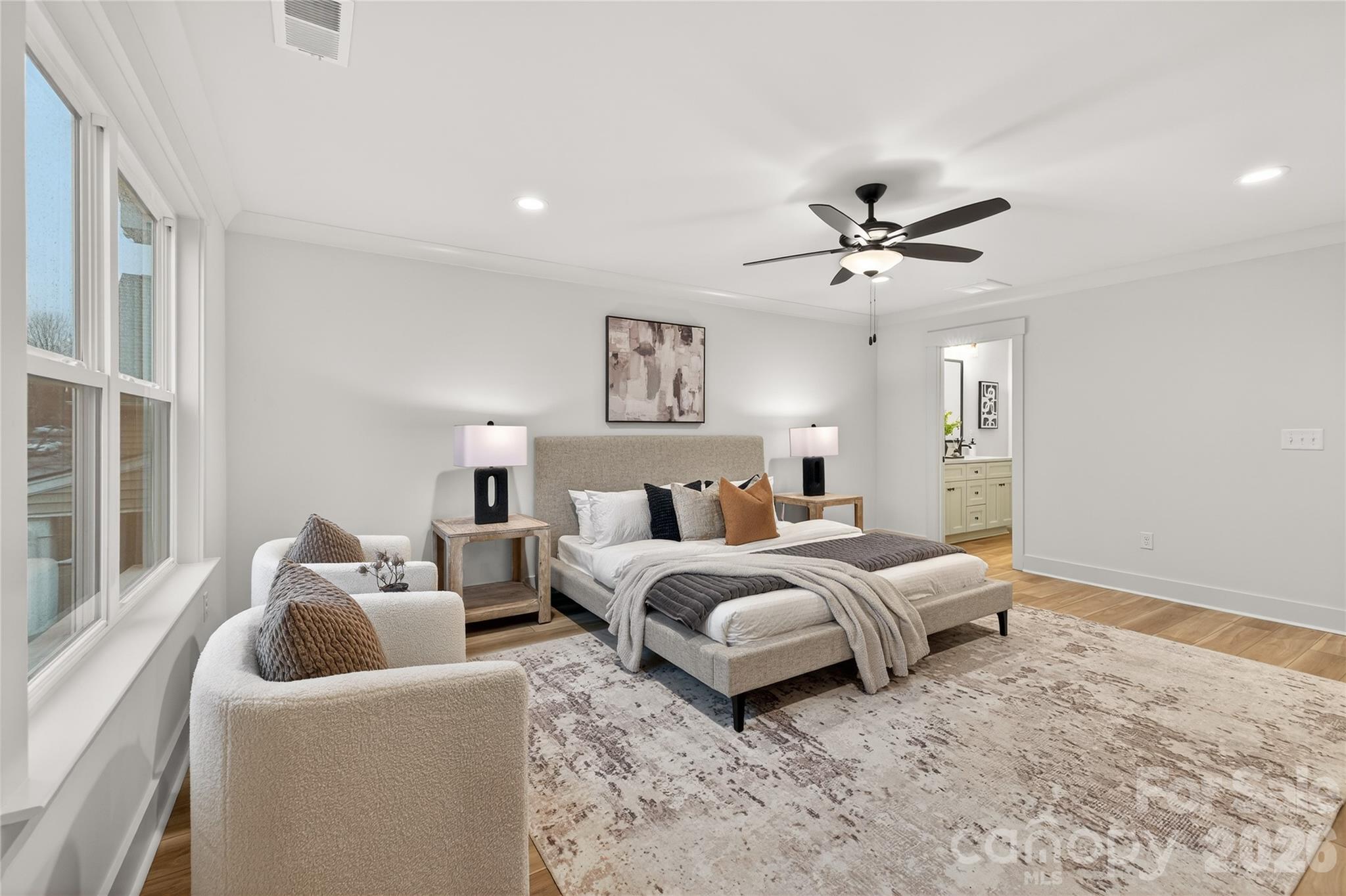 3388 Brackhill Street Davidson, NC 28036 - Photo 11 of 17 a spacious bedroom with a bed and a ceiling fan