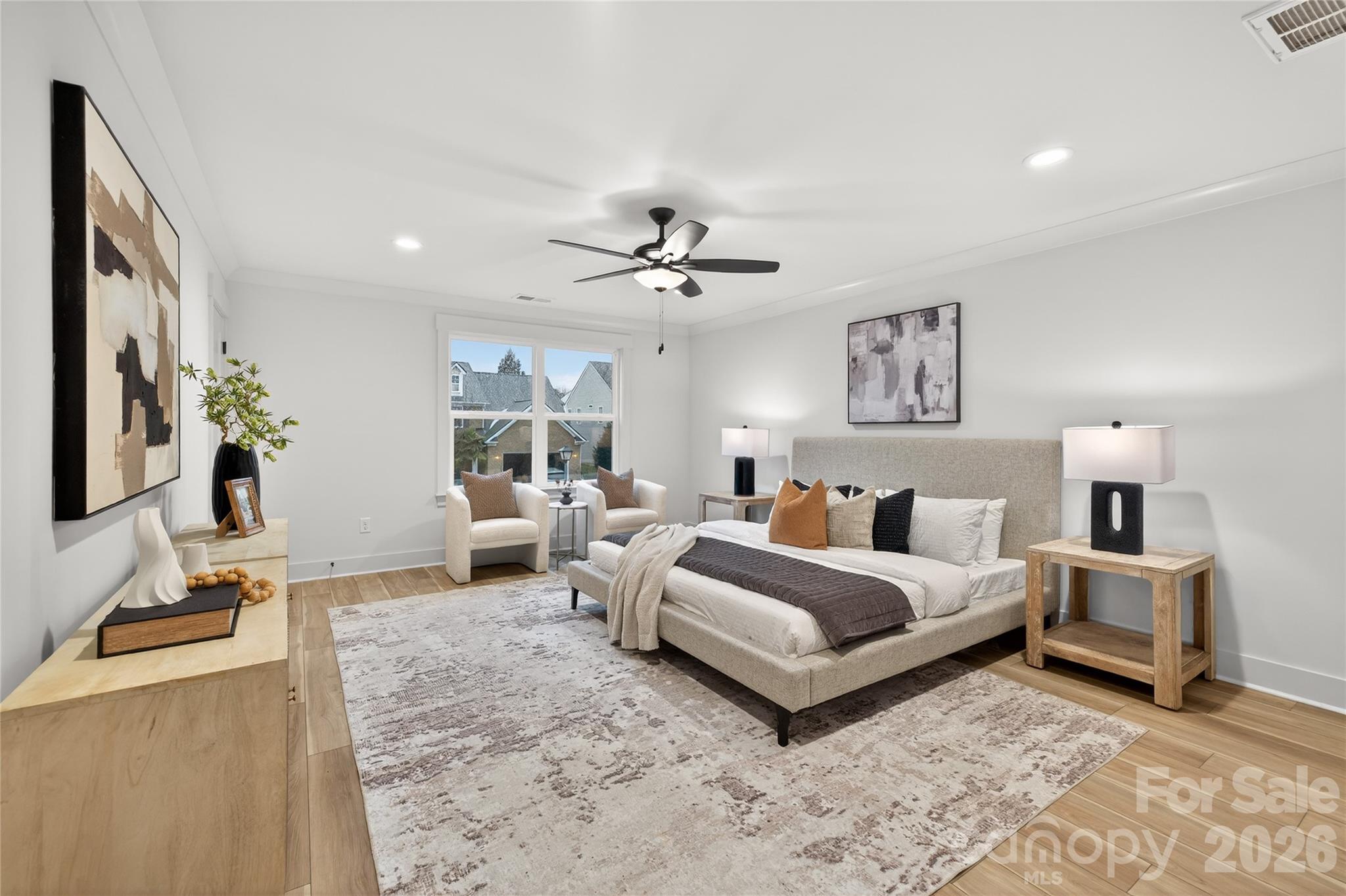 3388 Brackhill Street Davidson, NC 28036 - Photo 12 of 17 a spacious bedroom with a bed a couch and a chandelier