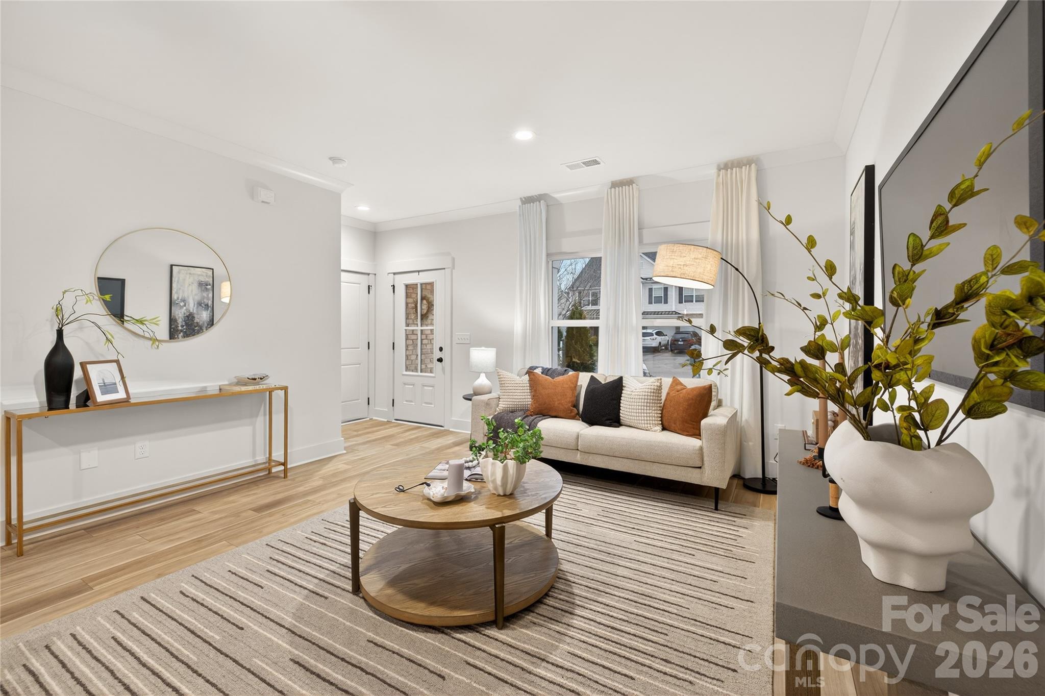 3388 Brackhill Street Davidson, NC 28036 - Photo 3 of 17 a living room with furniture and a potted plant