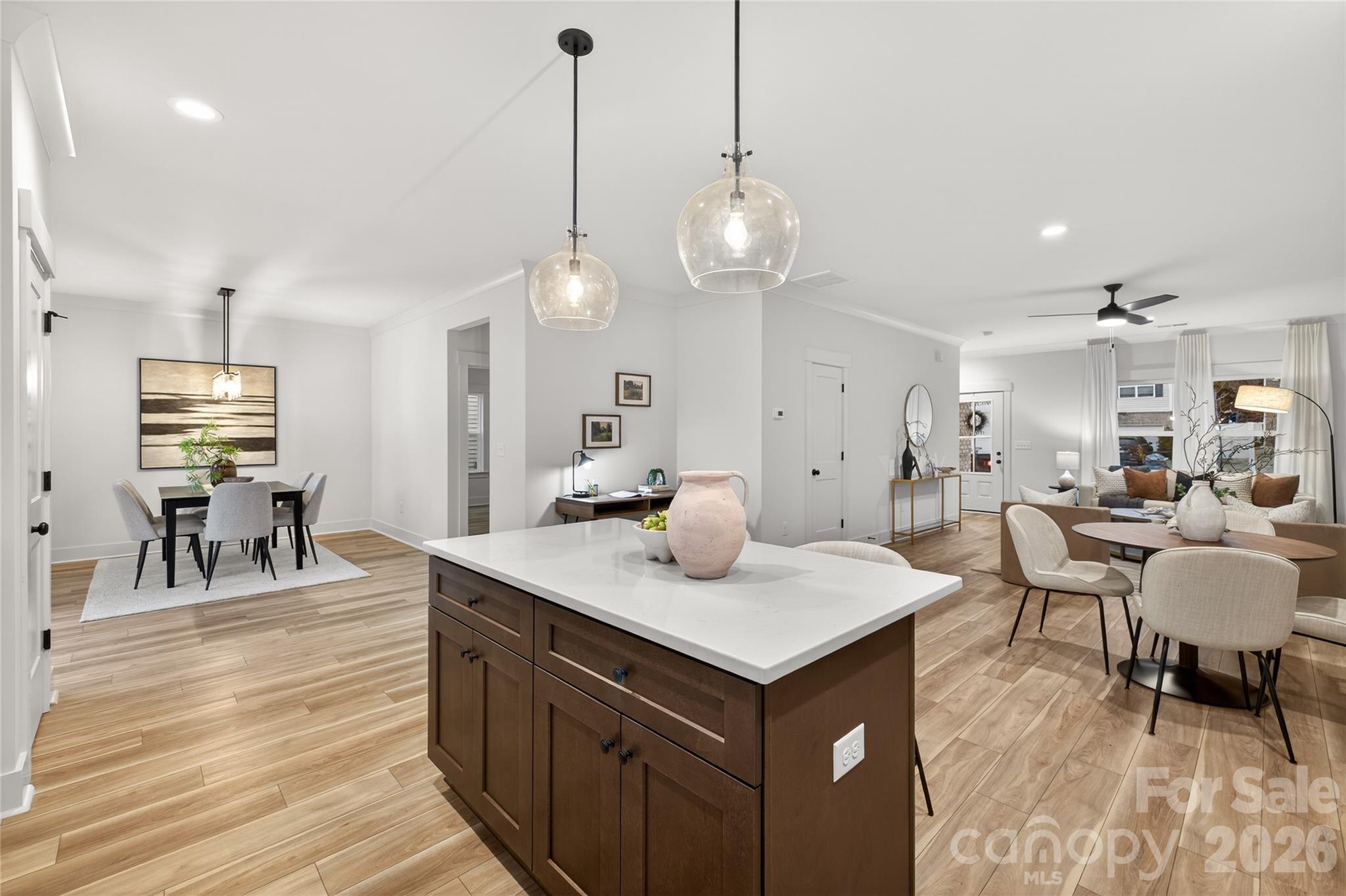 3388 Brackhill Street Davidson, NC 28036 - Photo 5 of 17 an open kitchen with a table and chairs in it