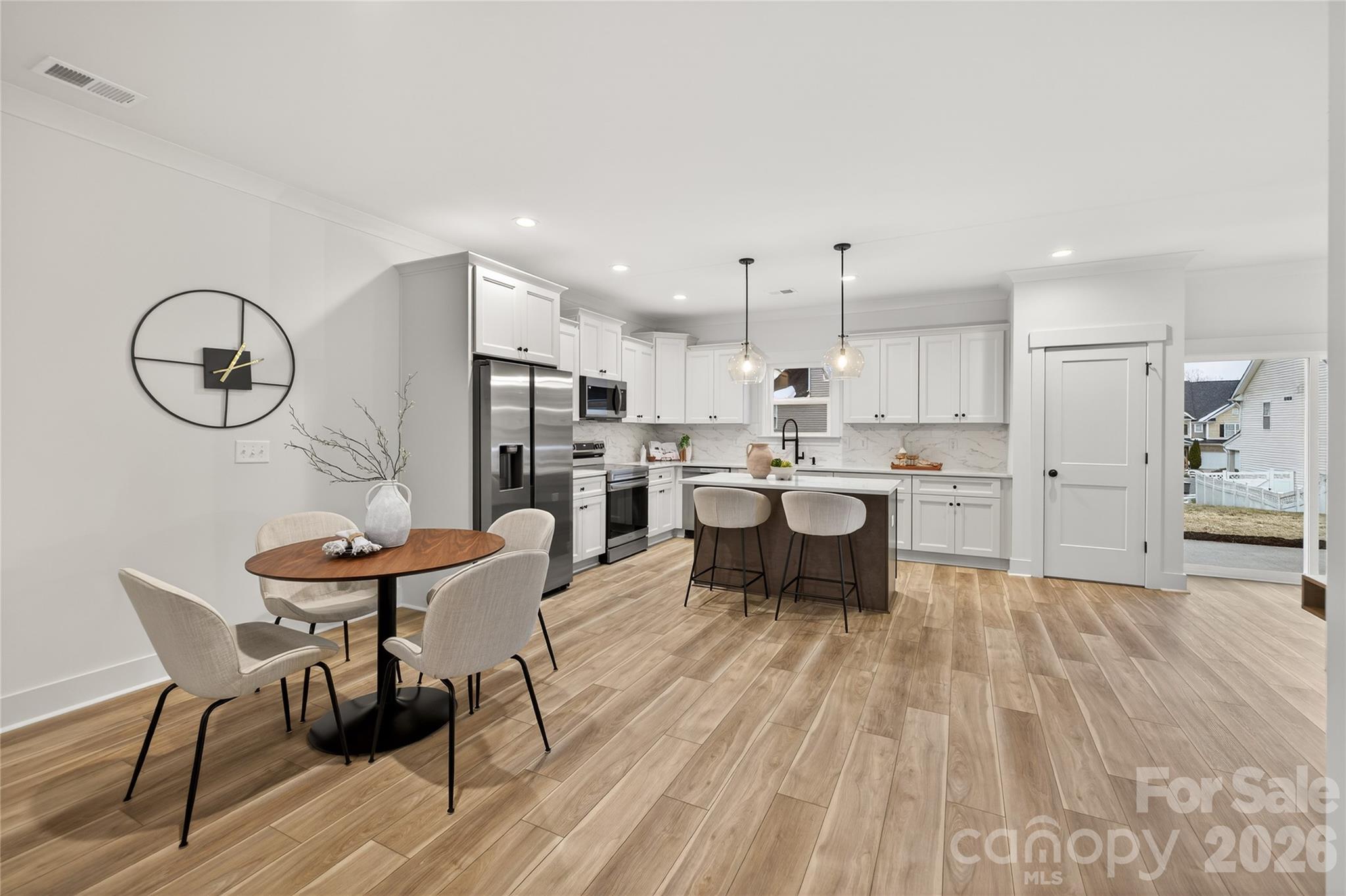 3388 Brackhill Street Davidson, NC 28036 - Photo 7 of 17 a living room with furniture and kitchen view