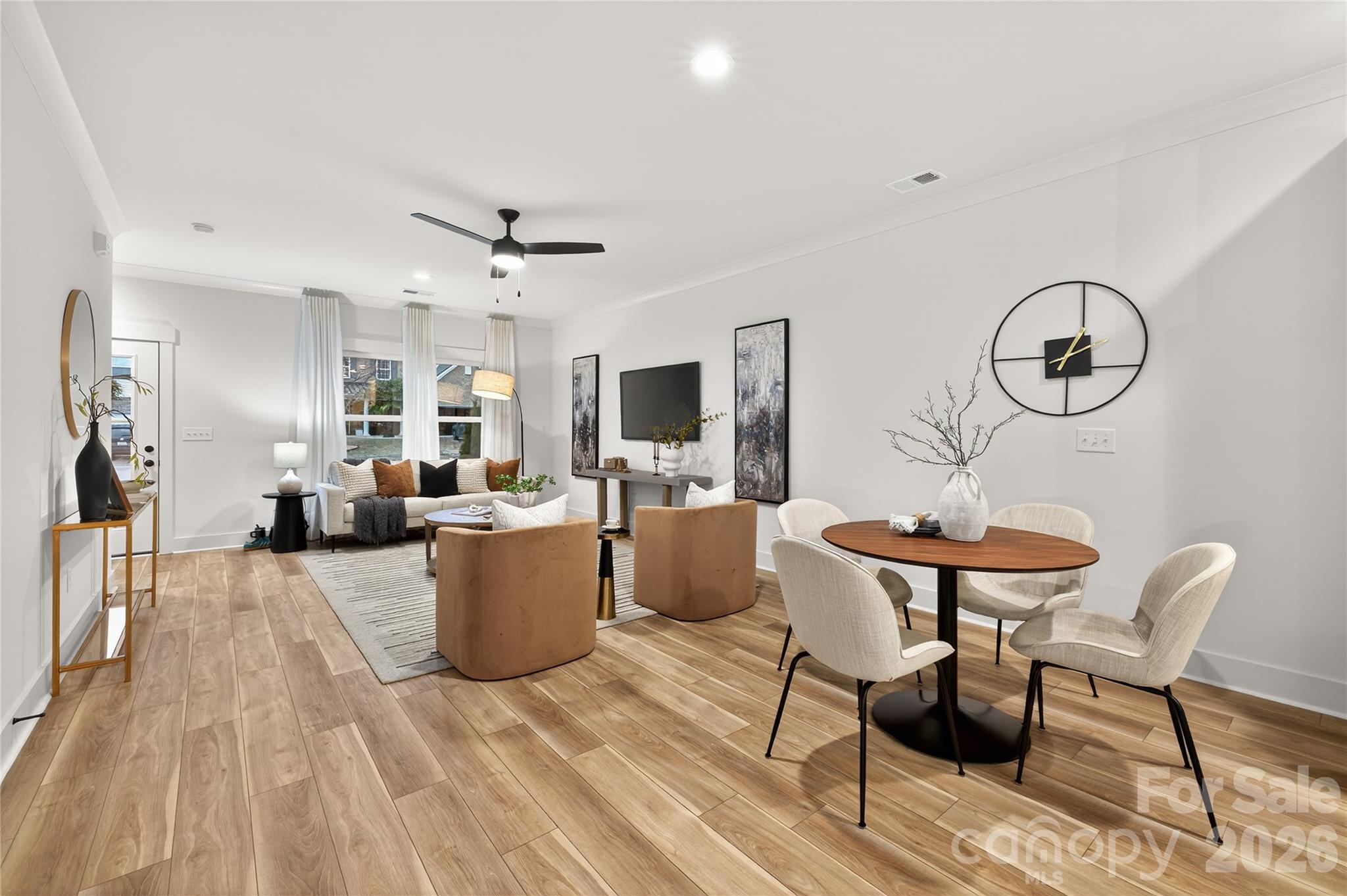3388 Brackhill Street Davidson, NC 28036 - Photo 8 of 17 a living room with a couch and a chandelier