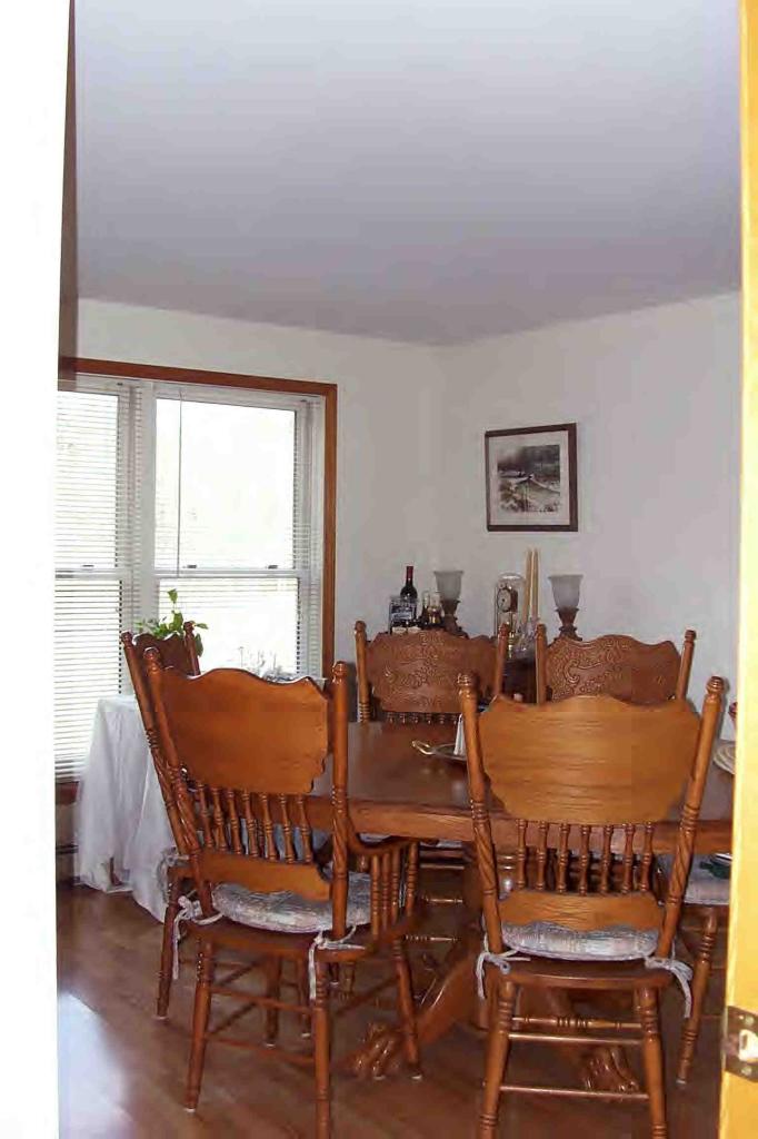 109 Pixley Road Monterey, MA 01230 - Photo 5 of 6 a view of a dining room with furniture window and wooden floor