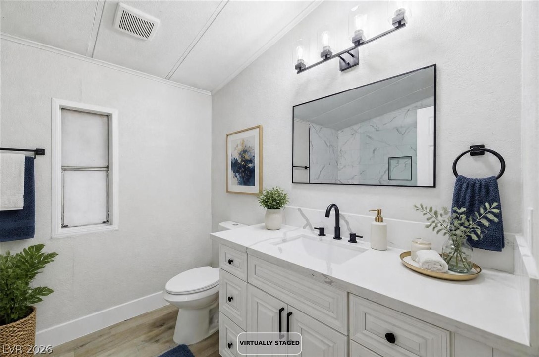 3940 Point Drive Pahrump, NV 89060 - Photo 22 of 35 A pristine vanity with generous counter space awaits in this well-appointed bathroom.
