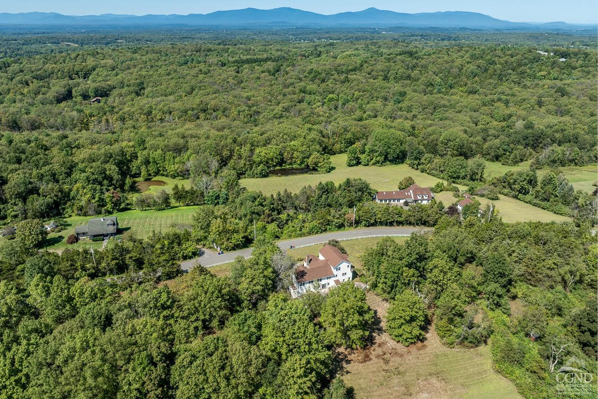 116 Battenfeld Road Milan, NY 12571 - Photo 2 of 23 a view of a city with lush green forest