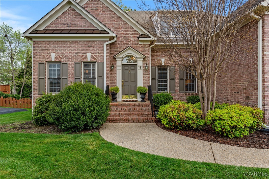 1007 Kingham Drive Midlothian, VA 23114 - Photo 2 of 42 a front view of a house with garden