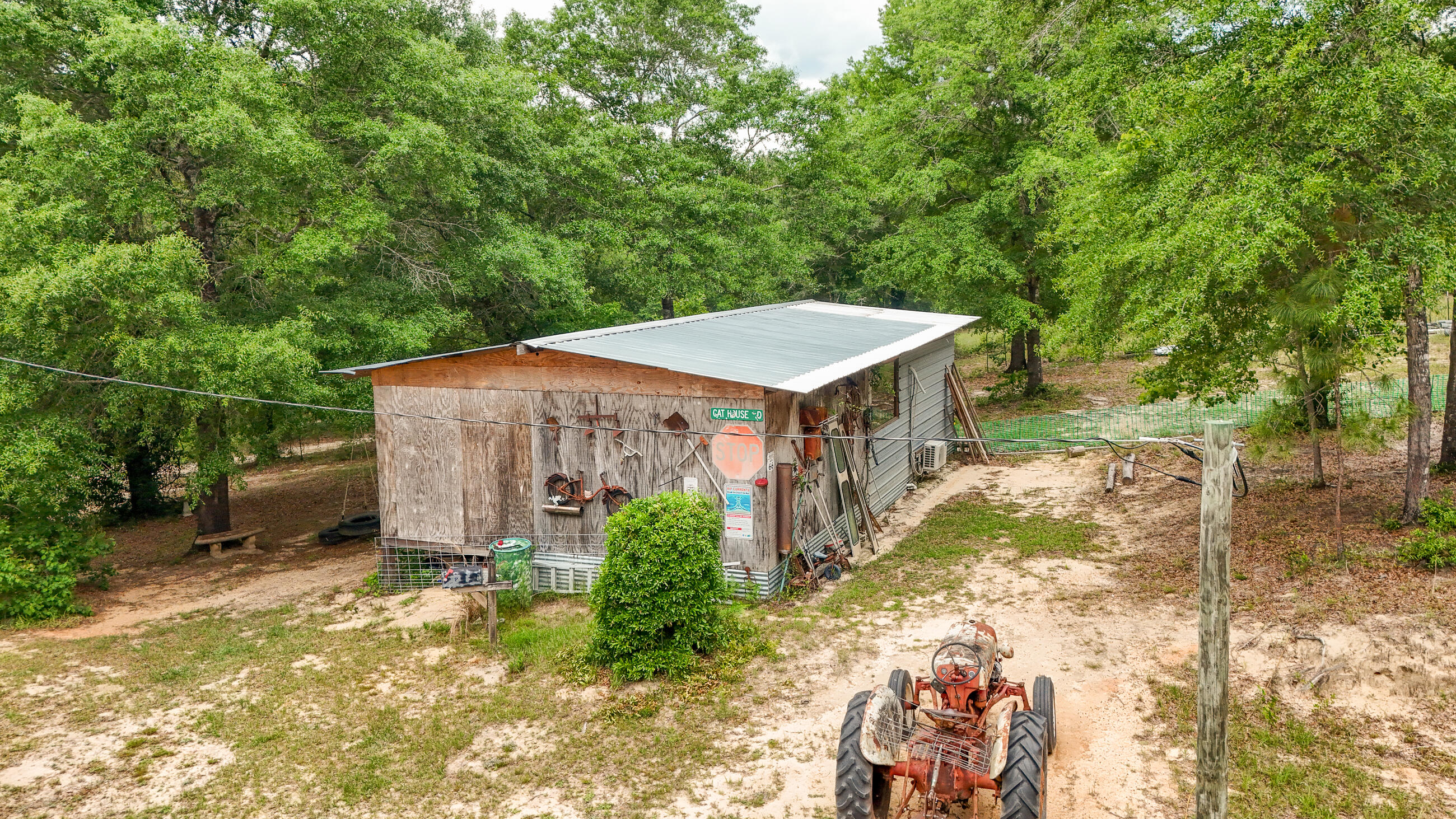 841 North 1st Street DeFuniak Springs, FL 32433 - Photo 13 of 63 a house with trees in front of it