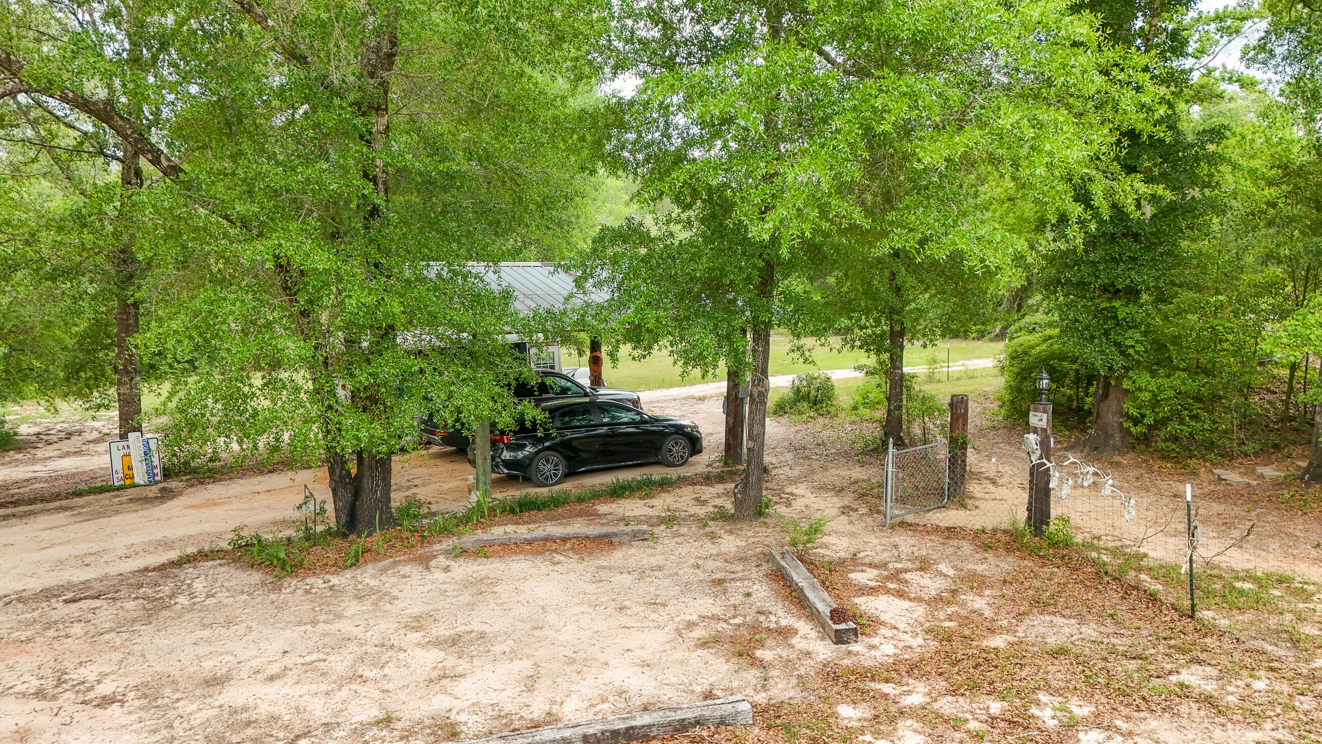 841 North 1st Street DeFuniak Springs, FL 32433 - Photo 18 of 63 a view of a tree in the middle of a yard
