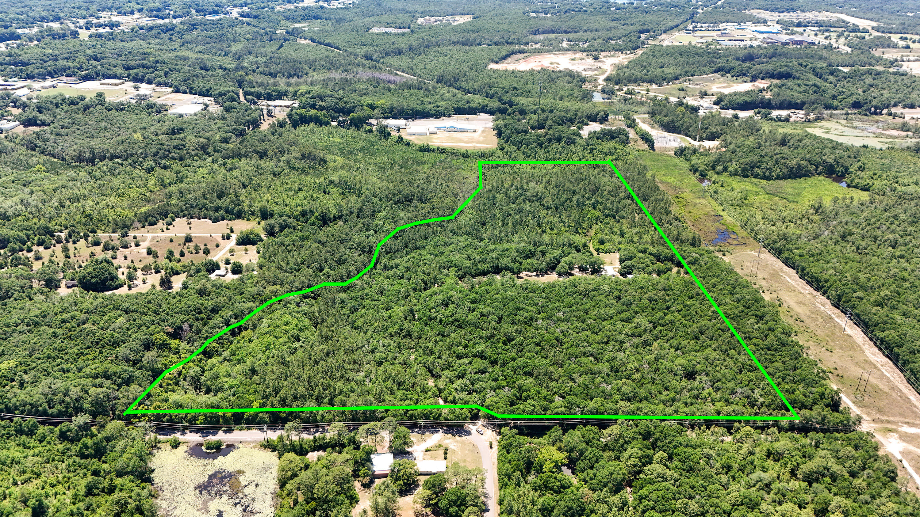 841 North 1st Street DeFuniak Springs, FL 32433 - Photo 2 of 63 a view of a garden with a tree