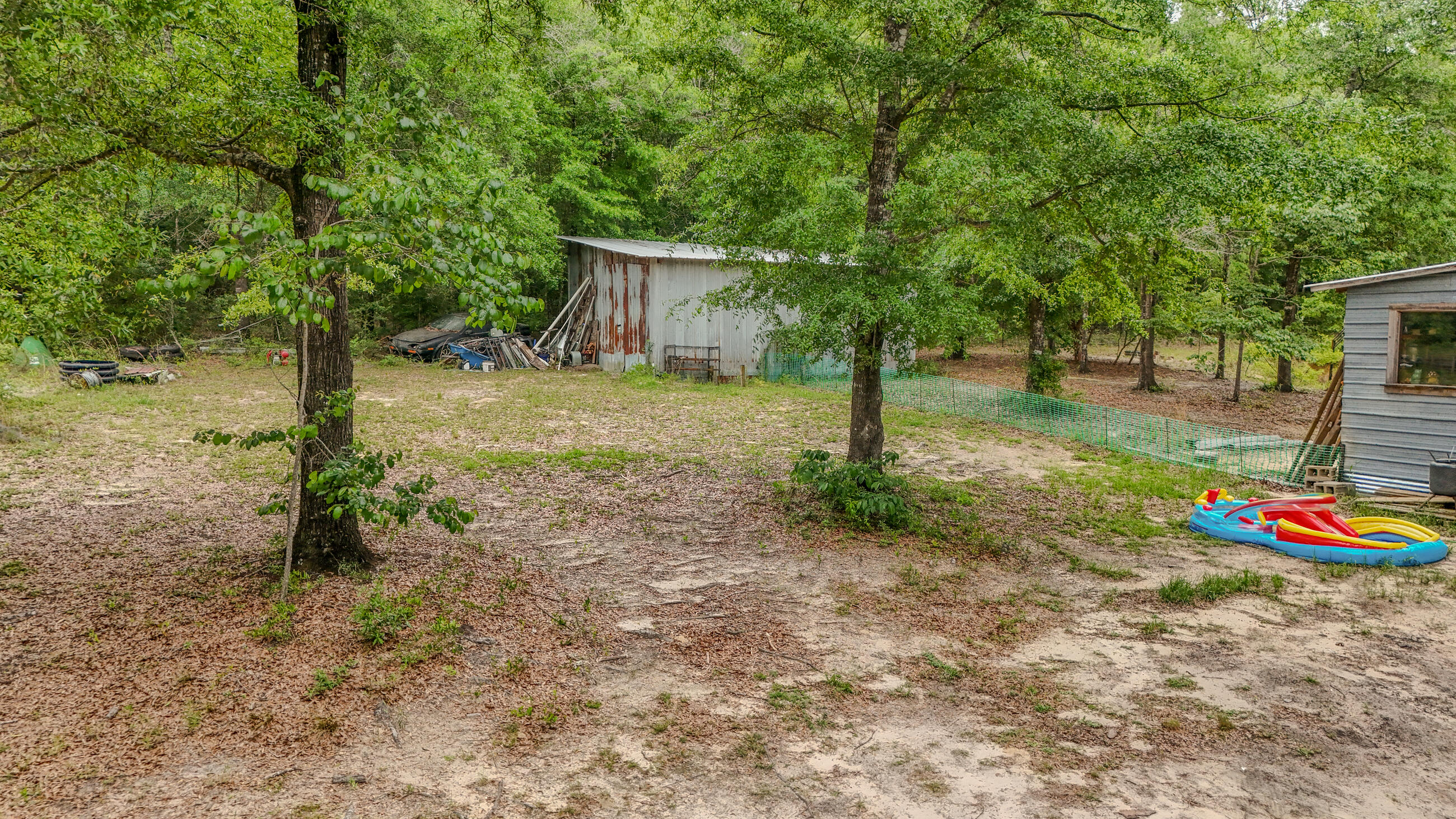 841 North 1st Street DeFuniak Springs, FL 32433 - Photo 23 of 63 a view of a house with backyard and tree