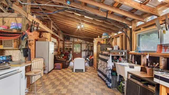 a view of steet with seating area