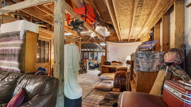 a view of a livingroom with furniture and staircase