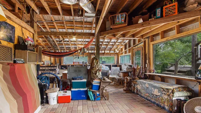 a bathroom with a toilet sink and shower curtain