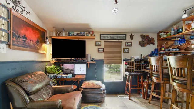 a bed room with a bed and a television