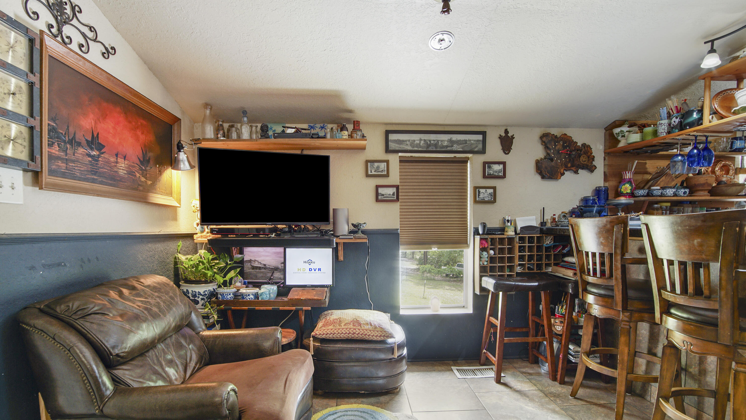 841 North 1st Street DeFuniak Springs, FL 32433 - Photo 38 of 63 a living room with furniture and a flat screen tv