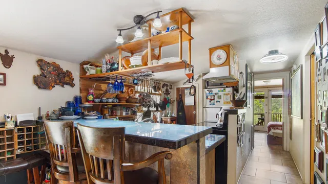 a bedroom with a large bed and a book shelf