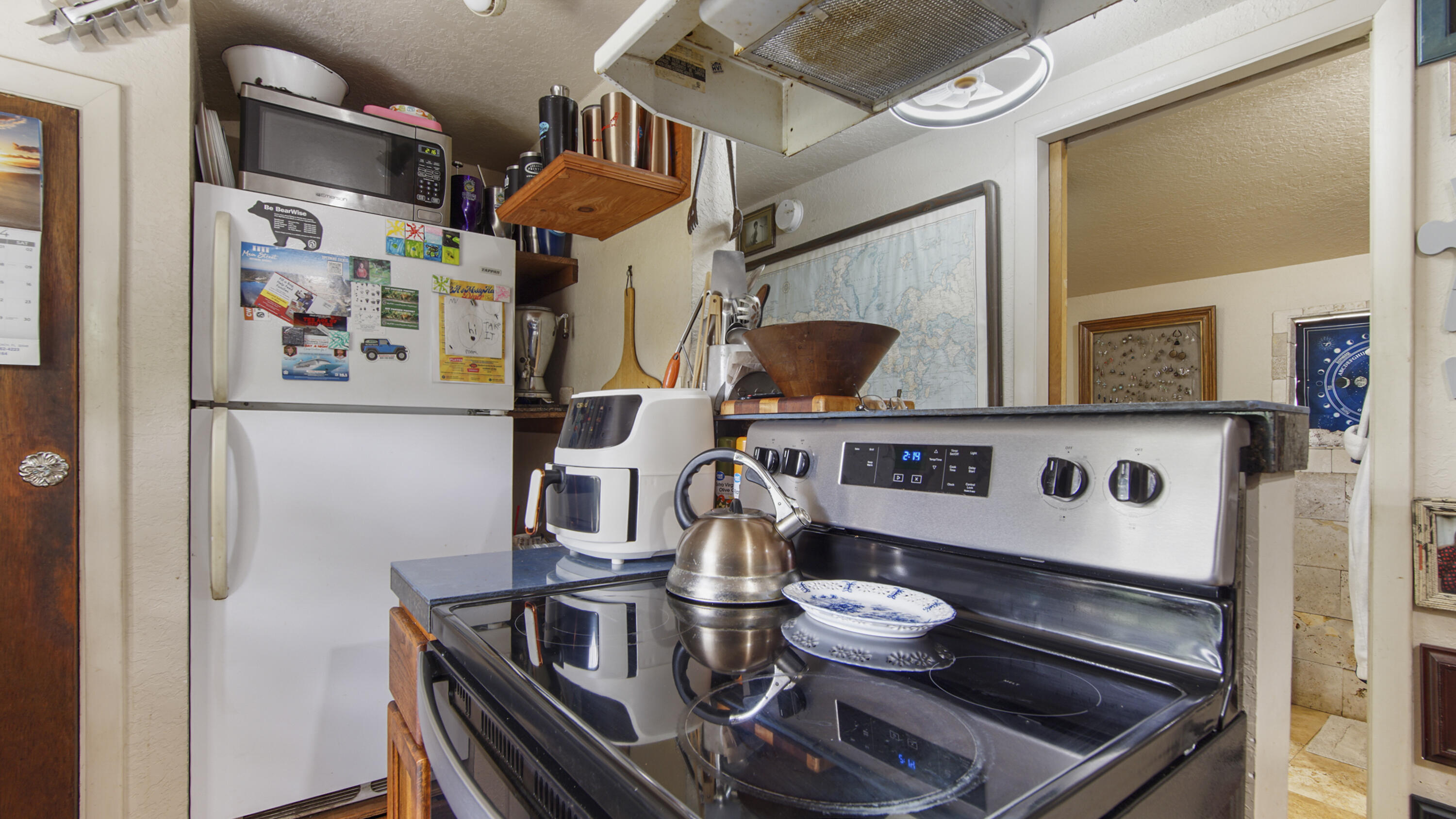 841 North 1st Street DeFuniak Springs, FL 32433 - Photo 41 of 63 a kitchen with a stove and a refrigerator