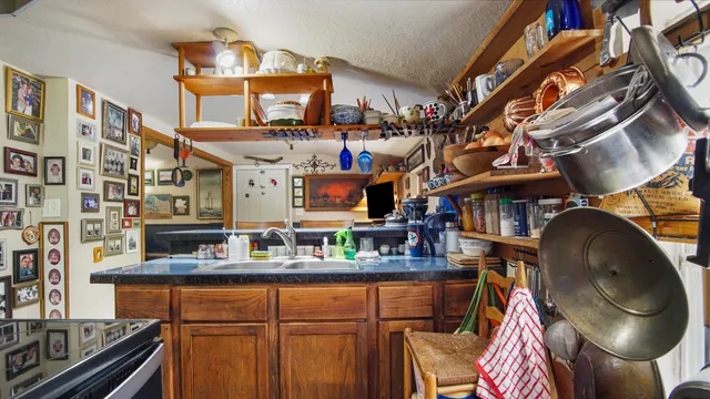 a view of a chairs and table in the balcony