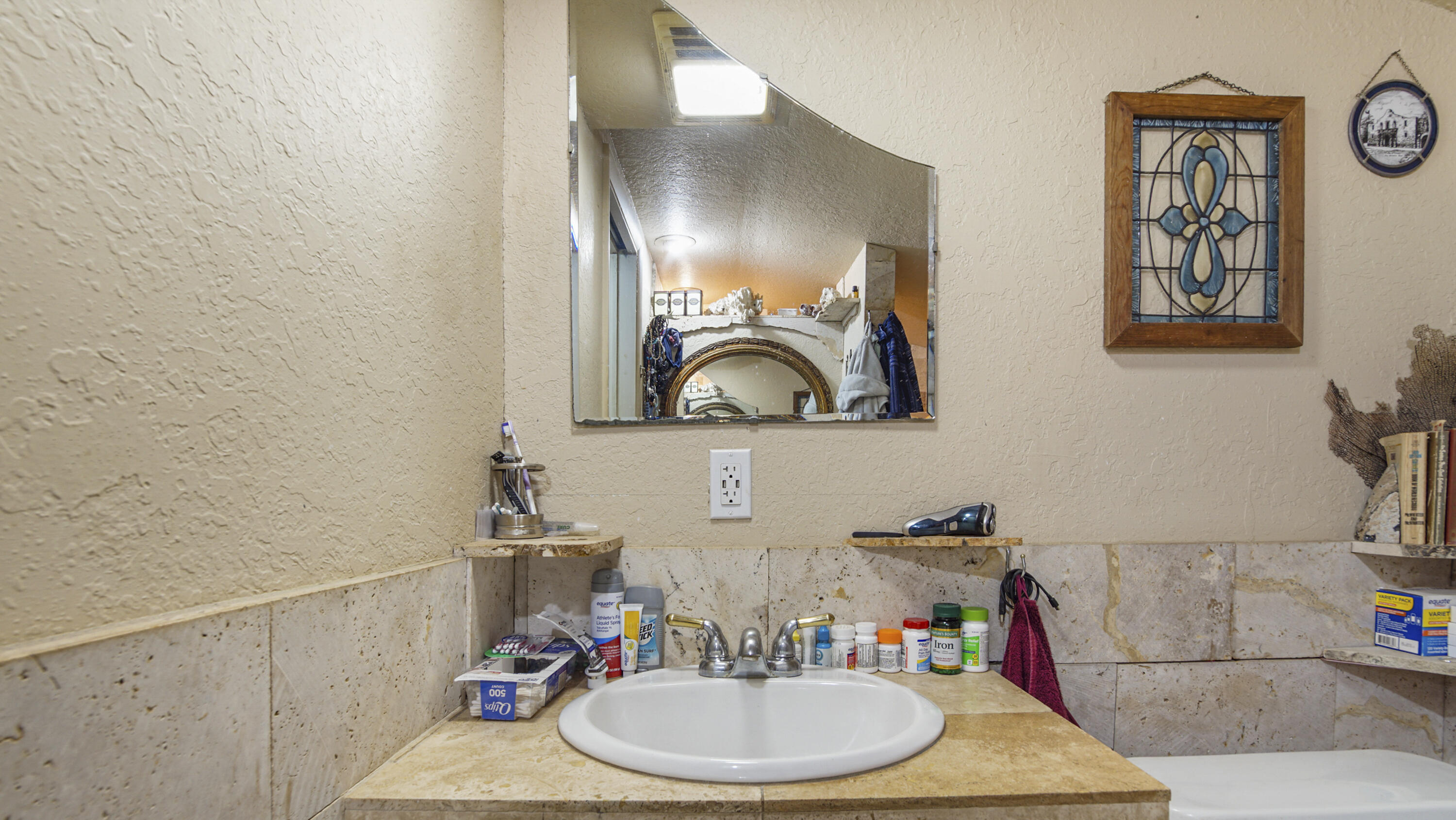 841 North 1st Street DeFuniak Springs, FL 32433 - Photo 44 of 63 a bathroom with a sink and a mirror