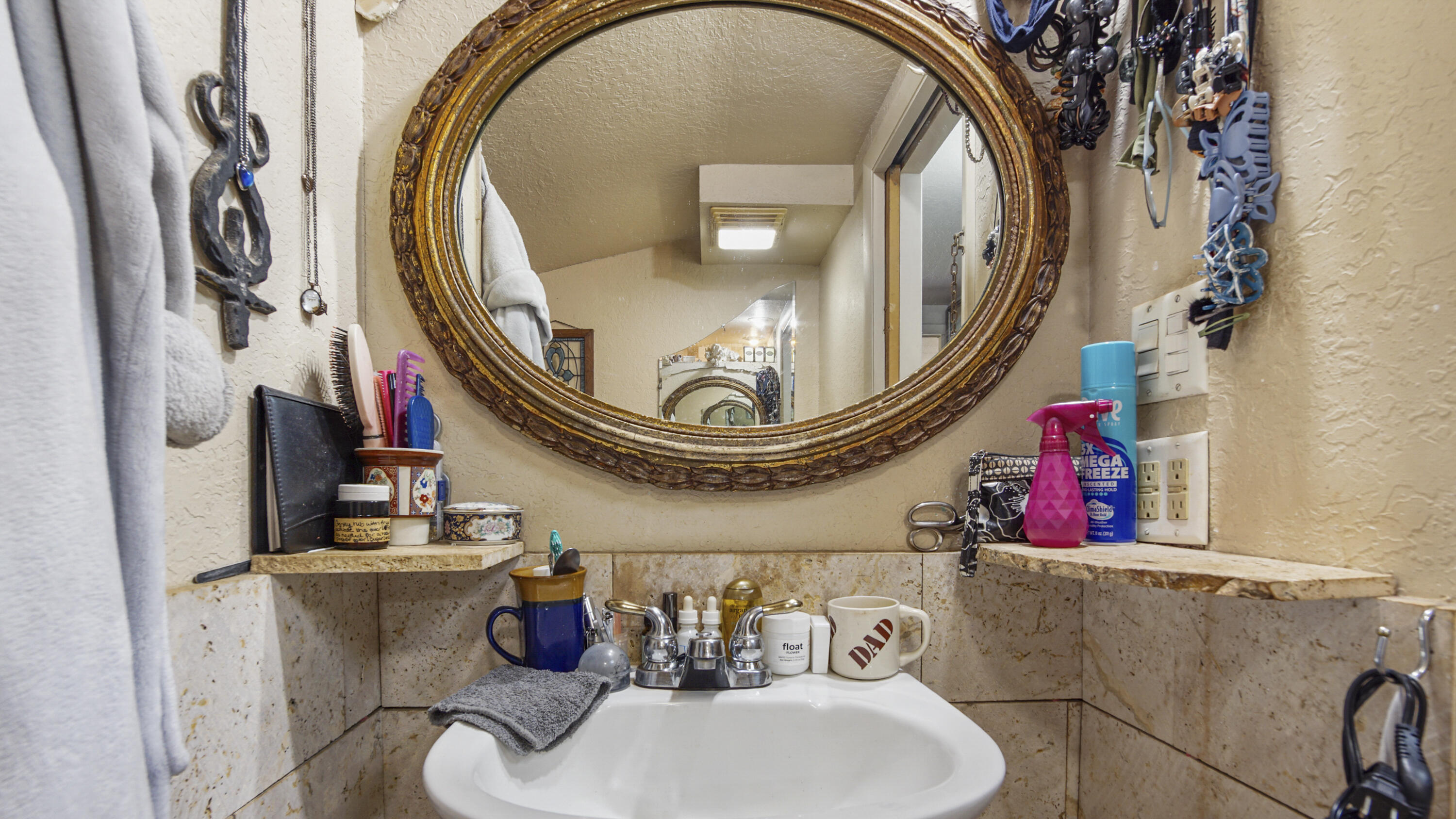 841 North 1st Street DeFuniak Springs, FL 32433 - Photo 45 of 63 a bathroom with a toilet a sink and a mirror