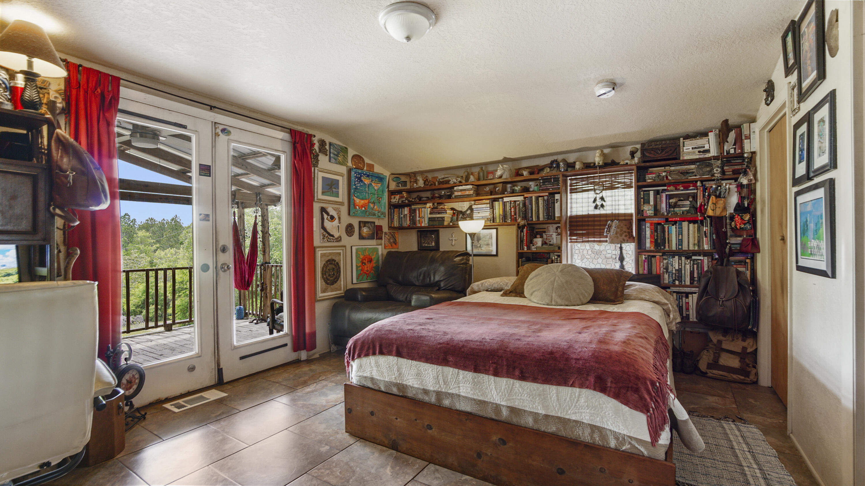 841 North 1st Street DeFuniak Springs, FL 32433 - Photo 49 of 63 a bedroom with a large bed and a book shelf
