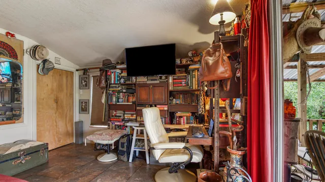 a bathroom with a shower curtain and a window