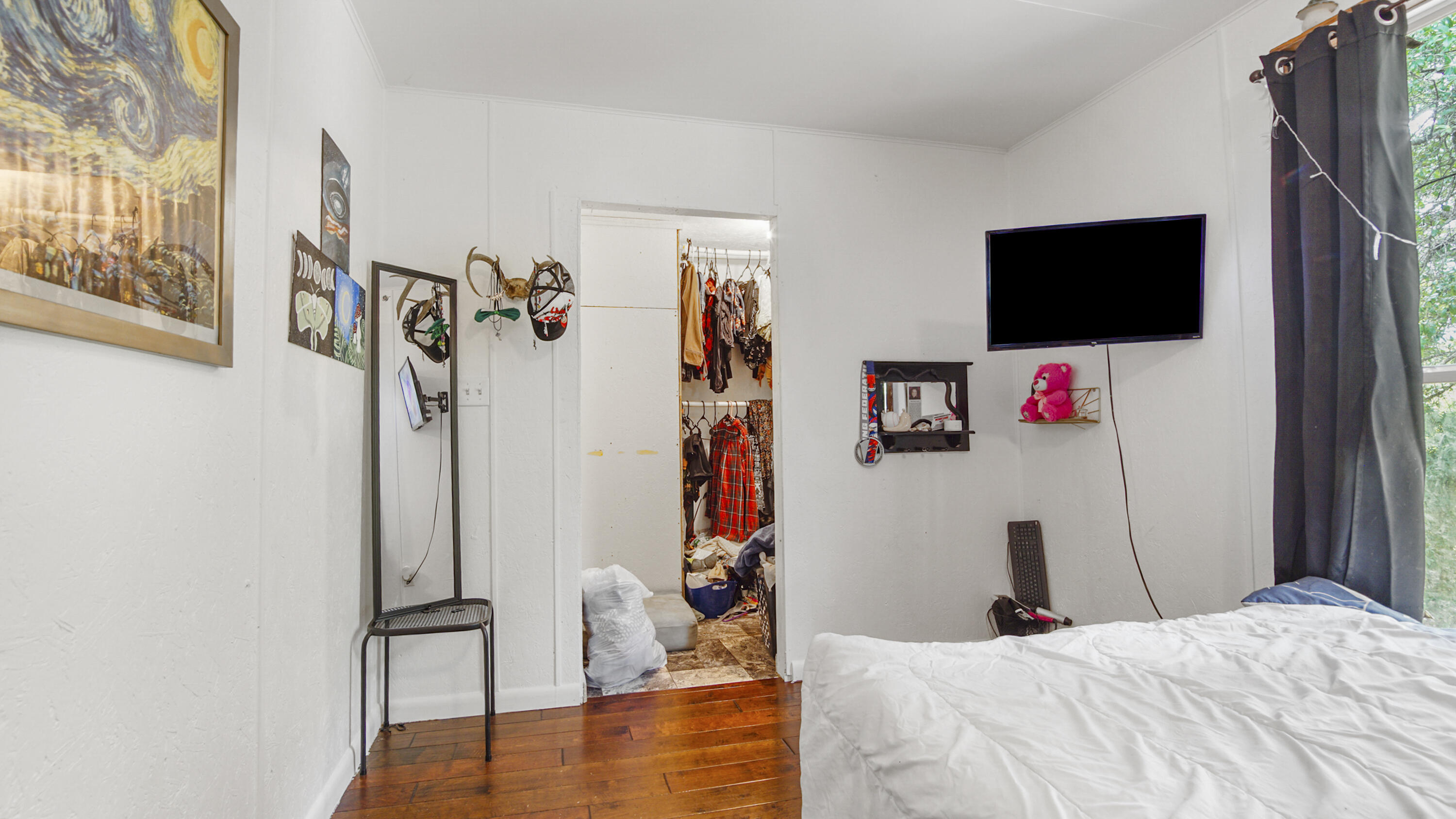 841 North 1st Street DeFuniak Springs, FL 32433 - Photo 60 of 63 a bed room with a bed and a flat screen tv