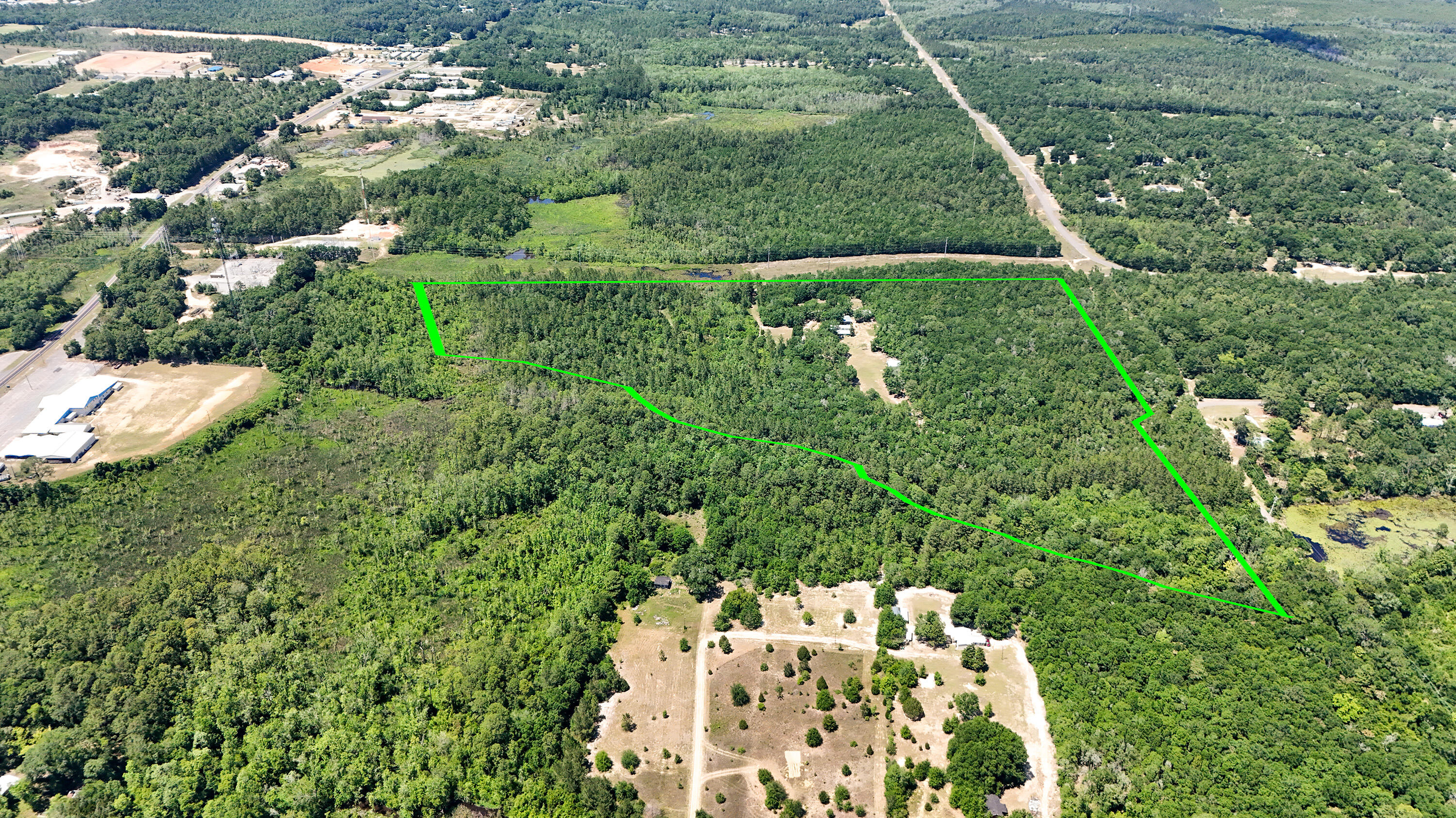 841 North 1st Street DeFuniak Springs, FL 32433 - Photo 6 of 63 a view of a yard with a tree