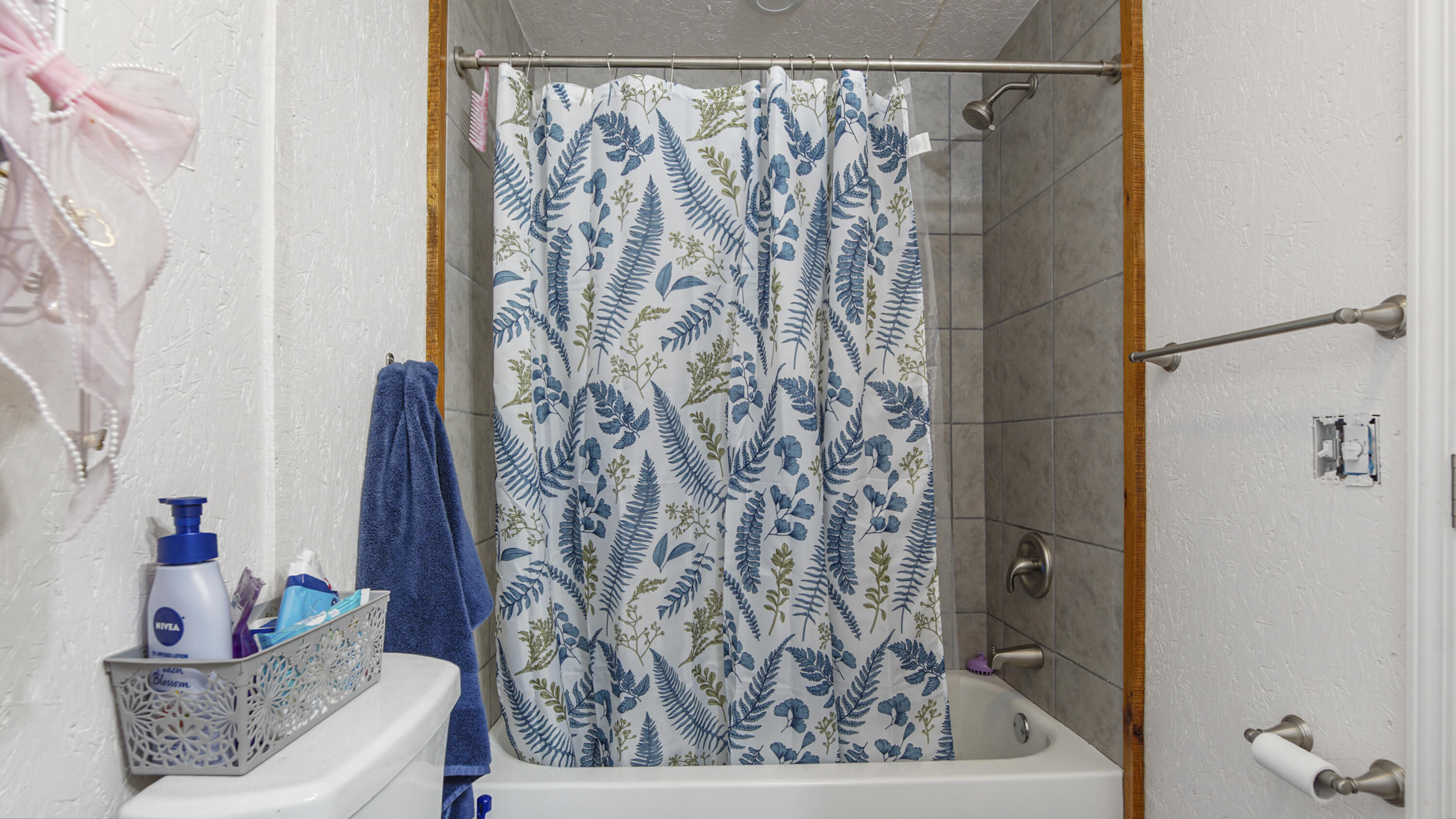 841 North 1st Street DeFuniak Springs, FL 32433 - Photo 63 of 63 a bathroom with a shower curtain and a window