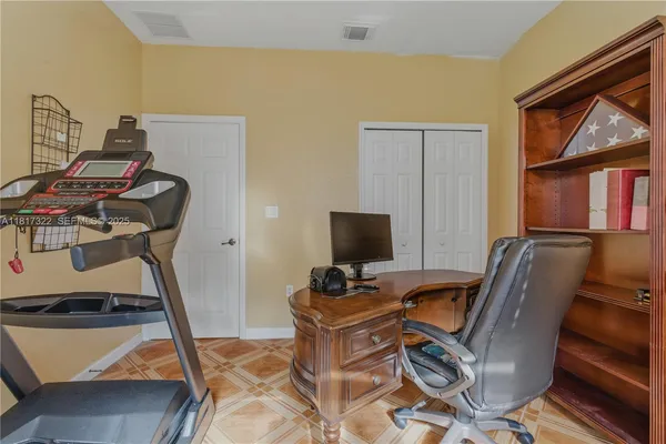 a bed sitting in a room next to a window