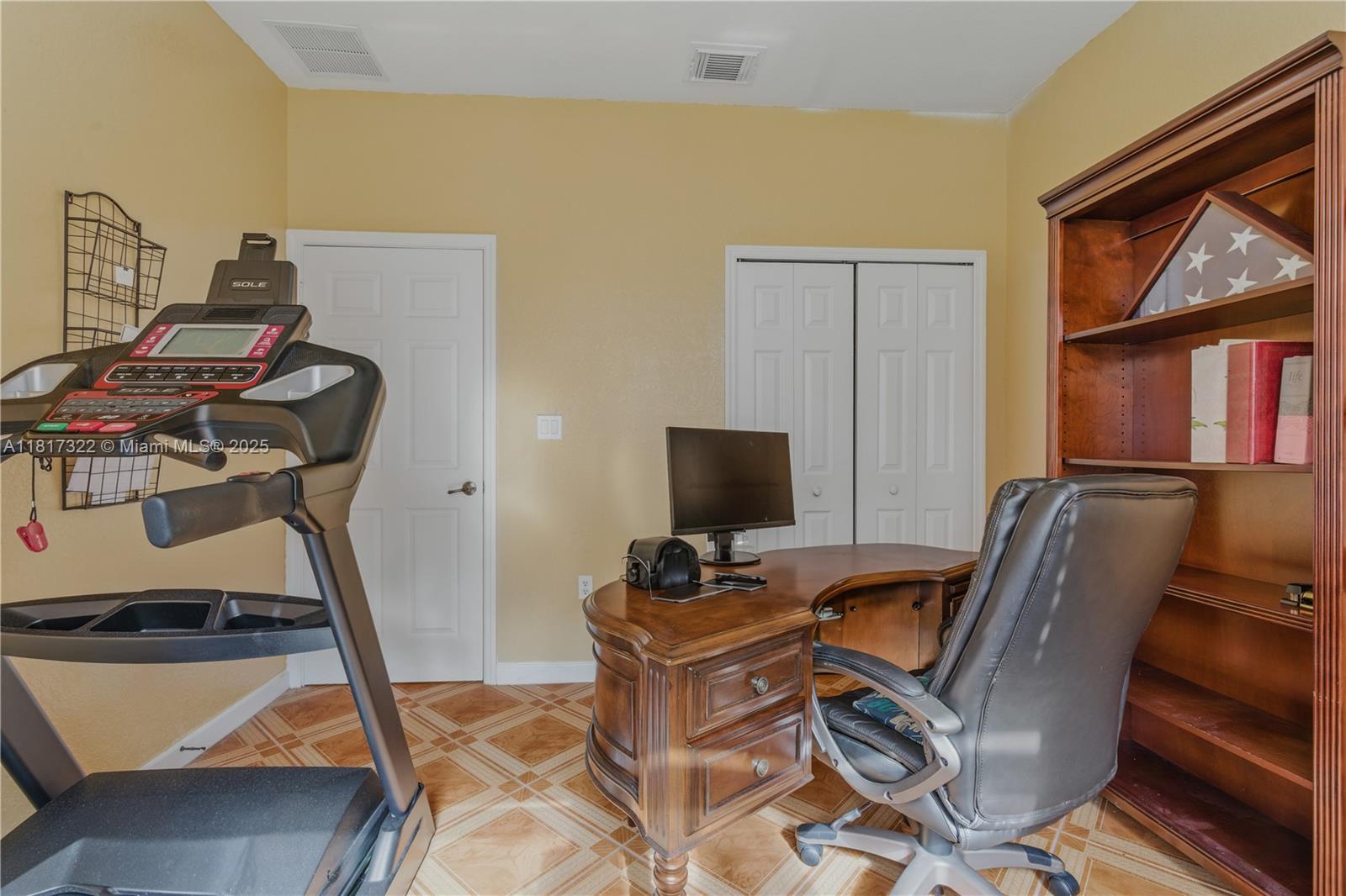 12251 Southwest 122nd Path Miami, FL 33186 - Photo 12 of 56 a view of workspace with wooden floor windows